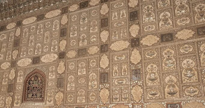 Exterior of the Wall of the Mirror Room Inside Sheesh Mahal in Amer (Amber) Palace complex. Amer, Rajasthan, India. Horizontal camera pan
