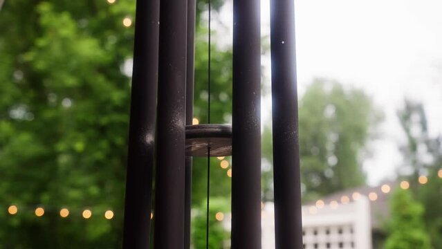 static shot of a wind chime flowing in the wind during the day