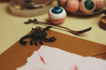 halloween still life with eyeballs, scorpions and insect