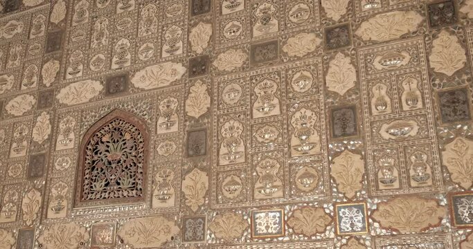 Exterior of the Wall of the Mirror Room Inside Sheesh Mahal in Amer (Amber) Palace complex. Amer, Rajasthan, India. Horizontal camera pan