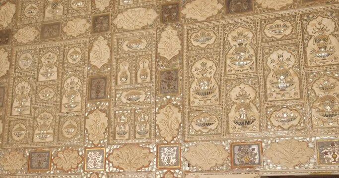 Exterior of the Wall of the Mirror Room Inside Sheesh Mahal in Amer (Amber) Palace complex. Amer, Rajasthan, India. Horizontal camera pan