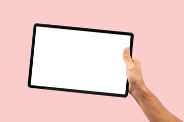 Black male hand holding black tablet, isolated on pink background