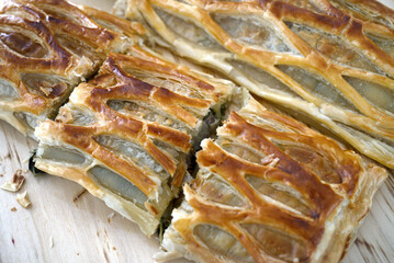Macro shot of Puff pastry filled with salmon and spinach