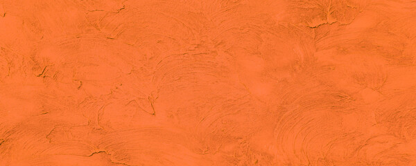 Orange plastered house wall as a texture, pattern, background