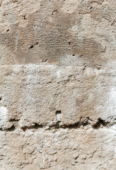 Stone wall background. Organic surface, a fragment of an old wall with damages. Grunge texture close up. - 649179514
