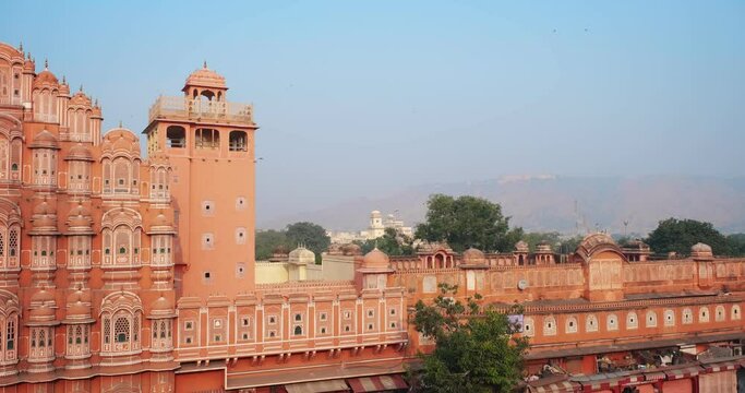 Famous Indian tourist landmark Hawa Mahal or Palace of the Winds in Jaipur city, Rajasthan, India. Hawa Mahal is an embodiment of Rajputana architecture. Camera horizontal panning