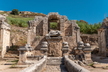 Fototapeta na wymiar Ancient city of Perge in Antalya, Turkey. Historical ruins in the ancient city of Pamphylia