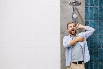 Man at the building market choosing shower for his bathroom