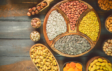 Assortment of Egyptian popular snacks sunflower seeds, watermelon seeds, pumpkin seeds and salted peanuts, roasted nuts and dried fruits.