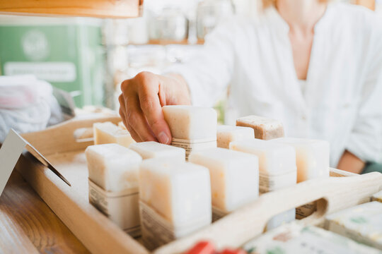 Woman buying scented soap in shop