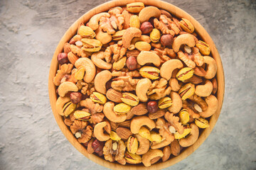  Mix of roasted salted nuts. Top view with copy space.