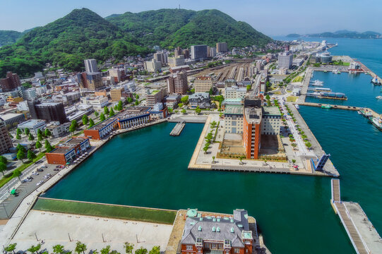Japan, Fukuoka Prefecture, Kitakyushu, Aerial view of Mojiku ward waterfront in summer