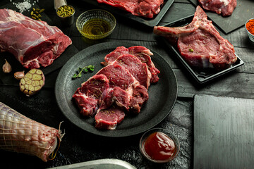  fresh tender beef on black background, shank meat, flank meat, rib meat ,chuck meat, round meat
