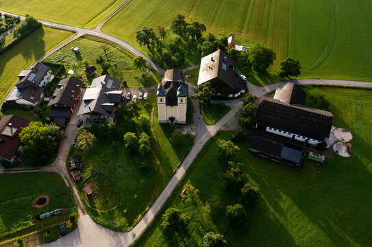 Austria, Upper Austria, Sankt Lorenz, Drone view of small village at dawn