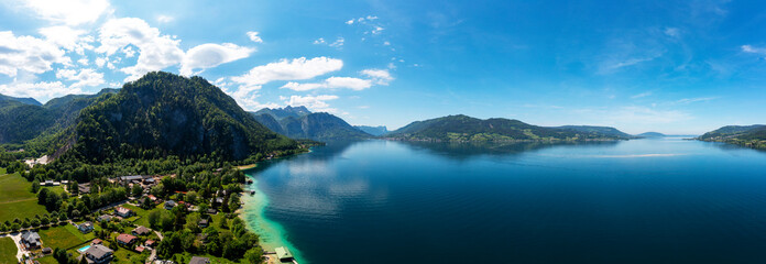 Austria, Upper Austria,Weissenbacham Attersee, Drone panorama of Lake Atter and surrounding village in summer