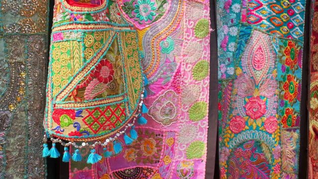 Traditional textile patchwork made of embroidery and stitched out of colored pieces of fabric. Bazaar in Pushkar, Rajasthan, India, Asia