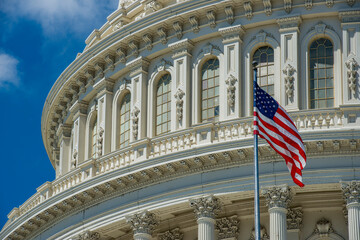 Washington DC Capitol dome detail with waving american flag