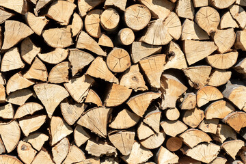 Stacks of Firewood. Preparation of firewood for the winter.