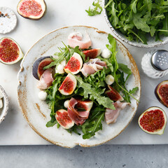 Arugula salad with figs and mozzarella cheese