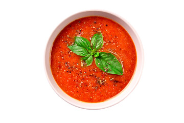 Tomato cream soup with basil and spices on a white background