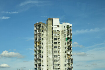 Old concrete and glass buildiung again the sky, minimal style