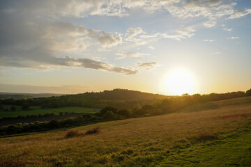 Looking at a sunset on countryside and farm fields