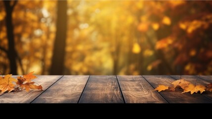 Naklejka na ściany i meble Wooden table and autumn leaves against blurred background with bokeh