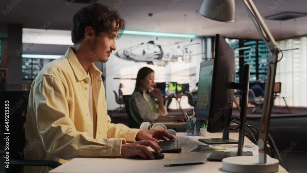 Aufkleber Caucasian Male Game Designer Using Desktop Computer With 3D Modeling Software To Design Unique Characters And World For Immersive RPG Video Game. Man Working In Game Development Company Diverse Office