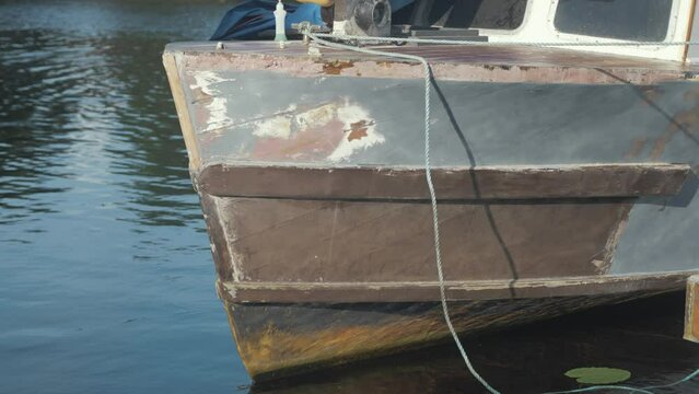 The bow of wood boat being faired ready for paint