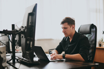 Portrait professional man programmer working concentrated on computer diverse offices. Modern IT technologies, development of artificial intelligence, programs, applications and video games concept.