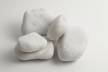 Fototapeta na wymiar Set of sauna stones isolated on white background. Natural mineral rock quartz, quartzite.