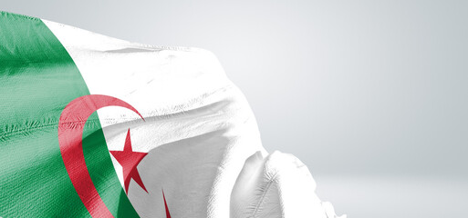 Algeria national flag cloth fabric waving on beautiful sky Background.