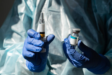 Doctor holds syringe and injection medicine