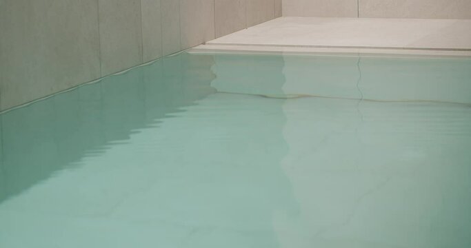 Modern swimming pool with clear water, closeup. Spa and recreation concept.