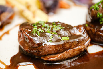 Delicious dish of fried beef steaks with sauce