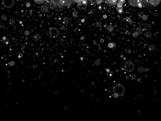 Particles of white magic dust. Shining light particles.Christmas glitter particles. Light effect on a transparent background.