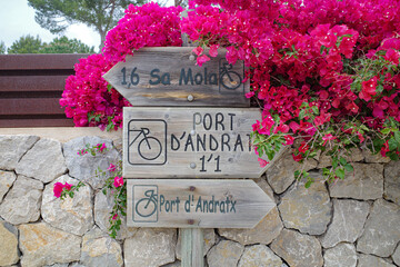 Port d'Andratx, Spain - 7 May, 2023: Signpost on a street into the town of Port d'Andratx, Mallorca