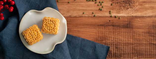 Delicious mung bean moon cake for Mid-Autumn Festival food mooncake on wooden table background.