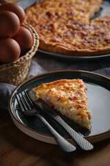 Piece of quiche served on plate