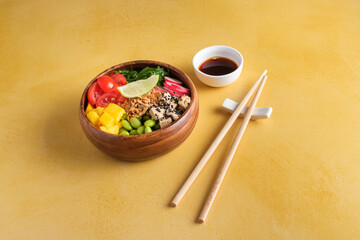 Fototapeta na wymiar Healthy bowl with chopsticks and soy sauce