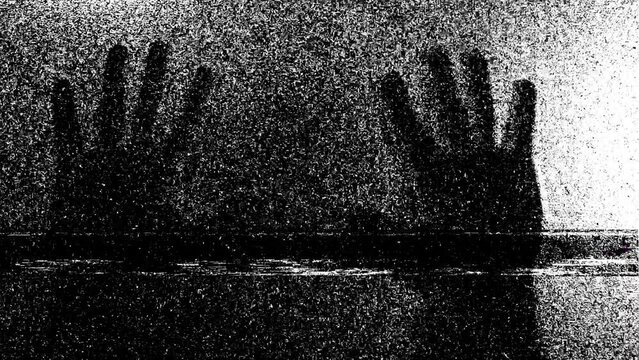 Silhouette of a mad male person or ghost and static tv black and white noise, scary movie tv screen noise
