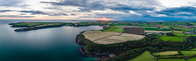 Panorama of Sunset over Fields and Farms from a drone, Monk Haven Beach, Pembrokeshire Coast Path,...