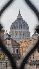 St. Peter's Basilica - Vatican. The photo was taken through a fence that complements the...