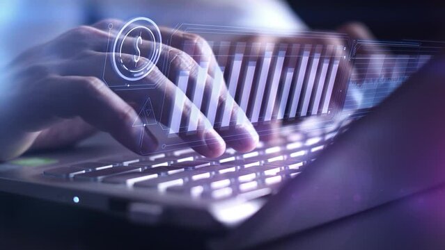 Working on a laptop with dollar exchange rate infographics.