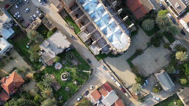 Flying over Lala Mustafa mosque in the center of Famagusta's old old in Northern Cyprus. This former cathedral was converted into a mosque after the Ottoman invasion of the city in 1571.
