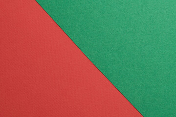 Rough kraft paper background, paper texture red green colors. Mockup with copy space for text.