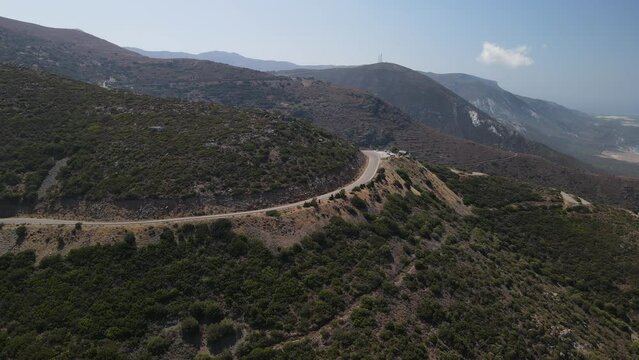 West Crete fly over though dry summer nature landscape and valleys during sunset phase