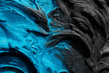 Decorative blue black putty background. Wall texture with filler paste applied with spatula,...