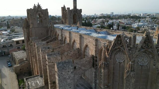 Drone flight past the Lala Mustafa mosque, a former cathedral in the old town of Famagusta city, historic monument in Northern Cyprus
