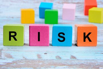 The word Risk on a wooden cubes 